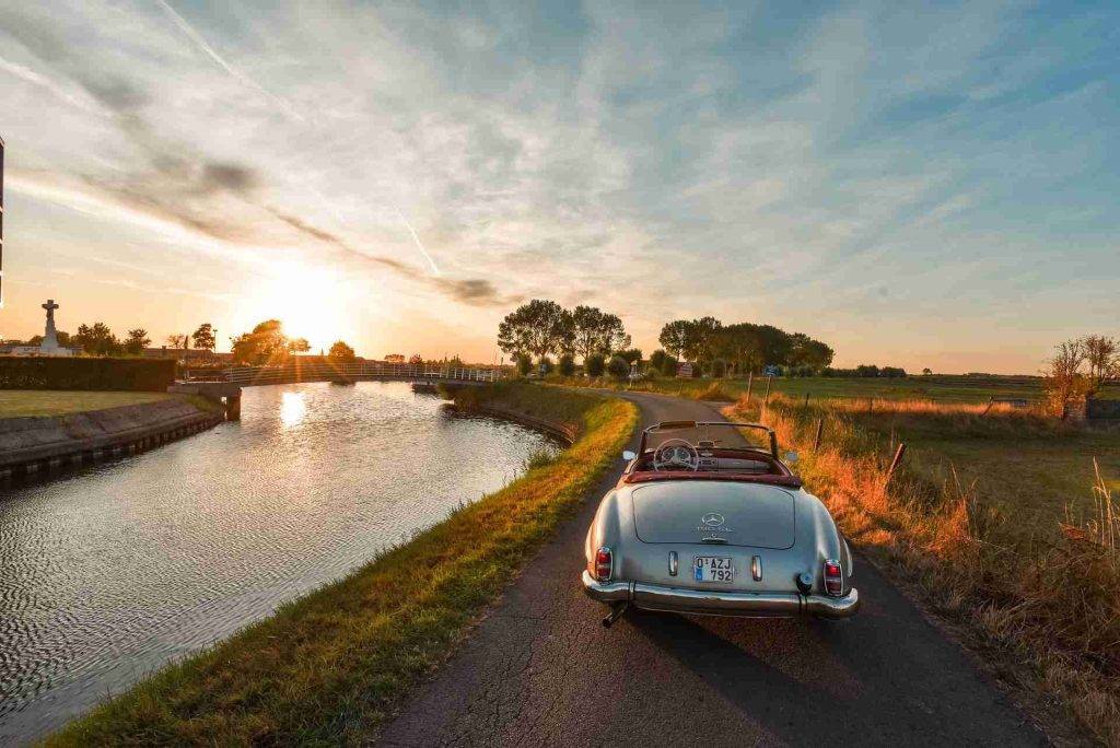 Goldstone Financial Retirement Landscape - Hero Image with Mercedes-Benz Car Driving in the Sunset